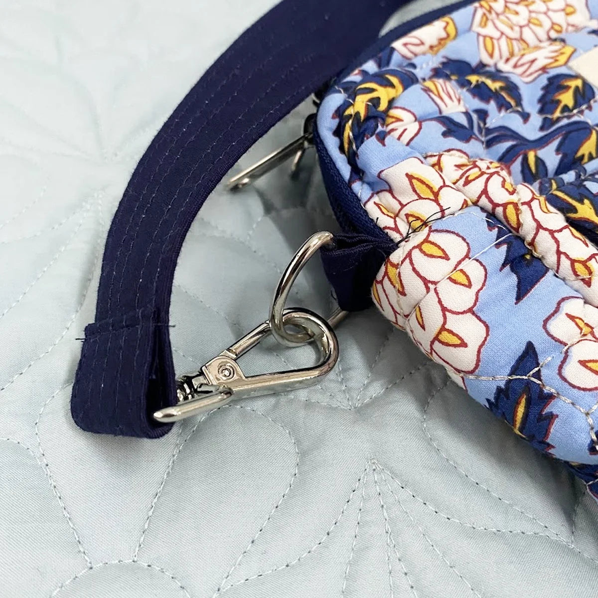 Freesia Sling: Vertical Quilted Sling Bag: Yellow Blue Flowers on Blue