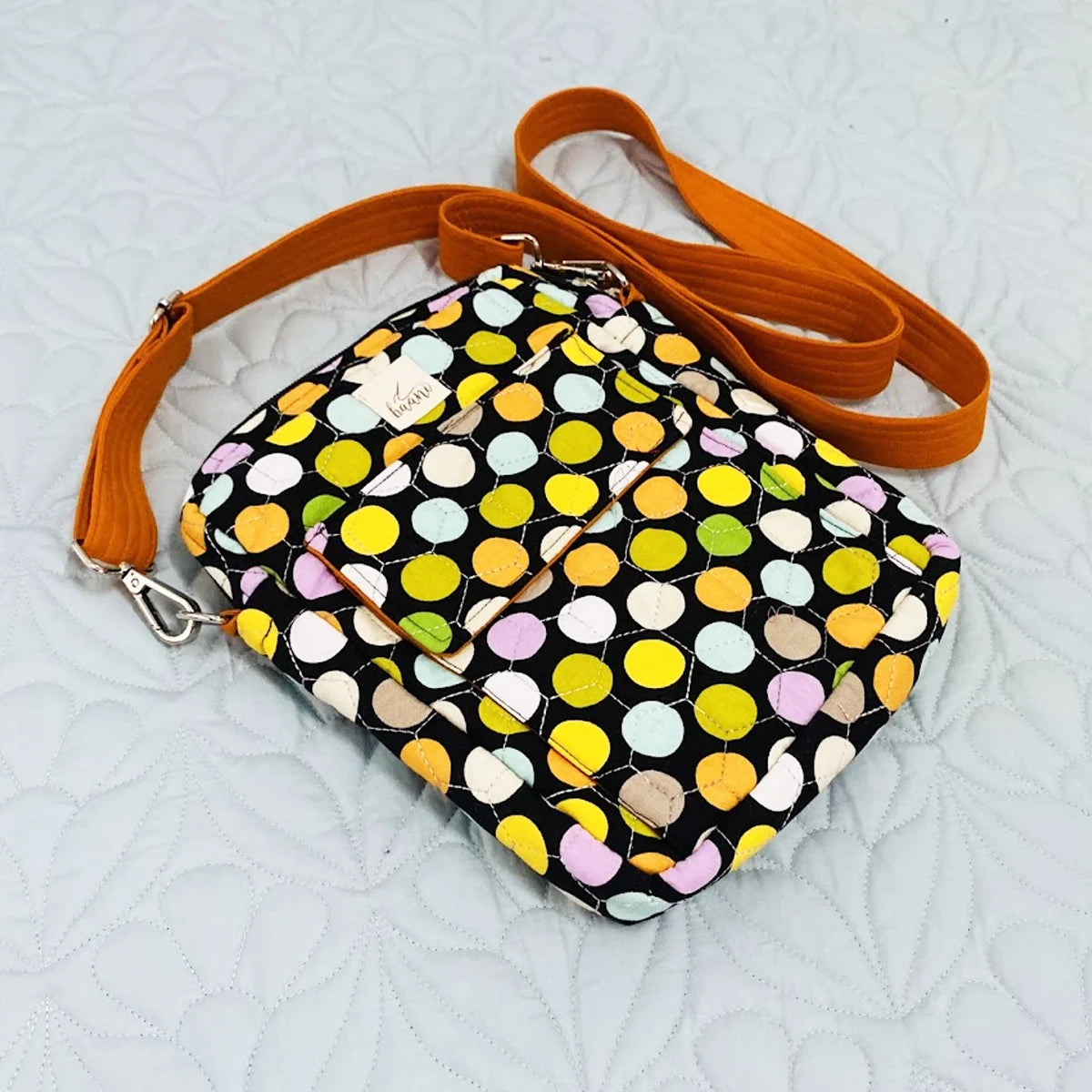 Freesia Sling: Vertical Quilted Sling Bag: Green Yellow Polka Dots on Black