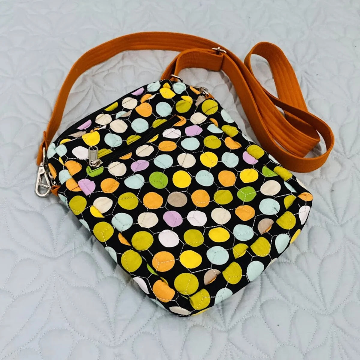 Freesia Sling: Vertical Quilted Sling Bag: Green Yellow Polka Dots on Black