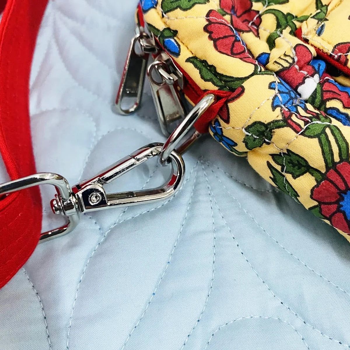 Freesia Sling: Vertical Quilted Sling Bag: Red Blue Green Flowers on Yellow